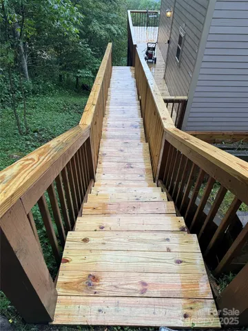 a view of balcony with wooden floor