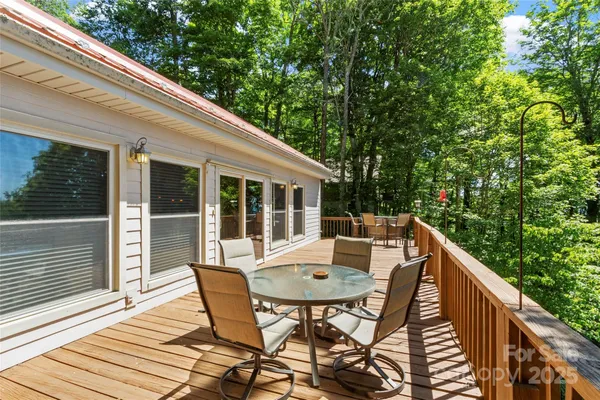 a balcony view with a seating space