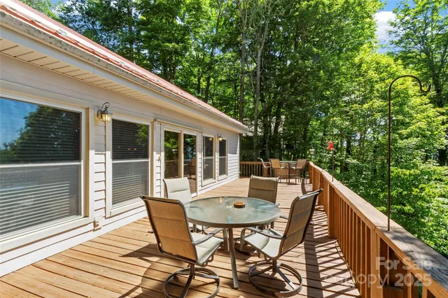 a balcony view with a seating space