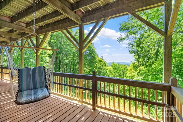 a view of balcony with wooden floor and outdoor space