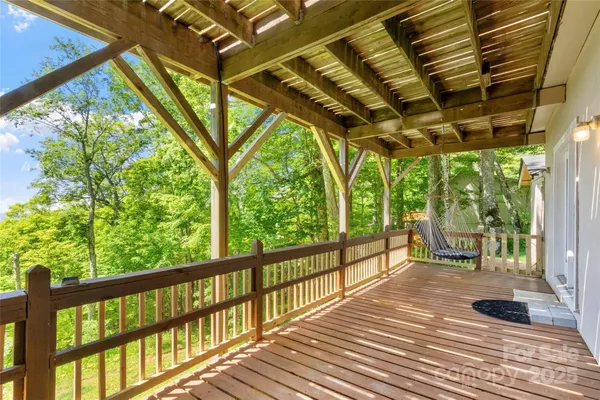 a porch with wooden floor and outdoor space