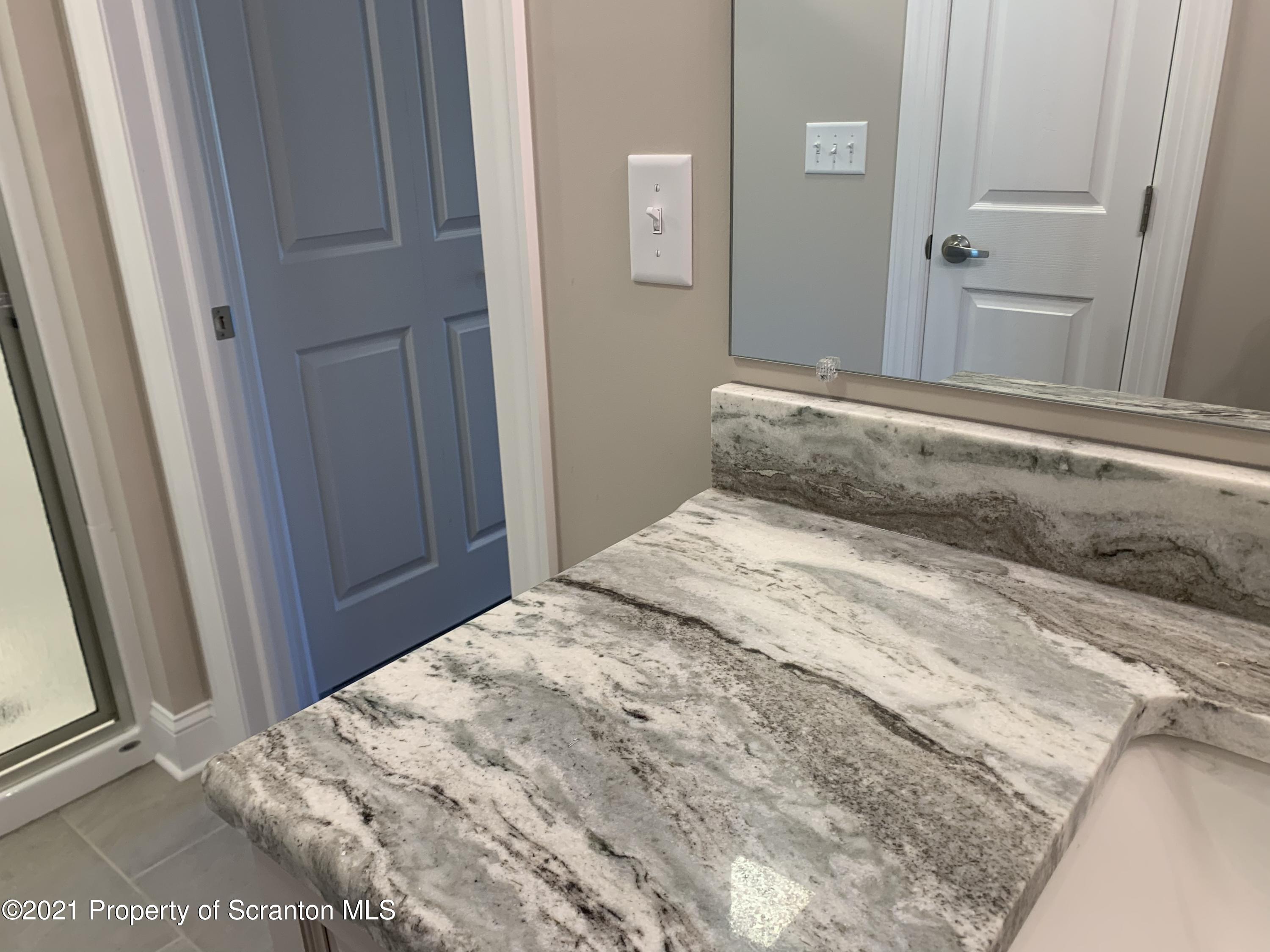 104 Deerfield Drive Eynon, PA 18403 - Photo 15 of 25 a bedroom with a bed and hardwood