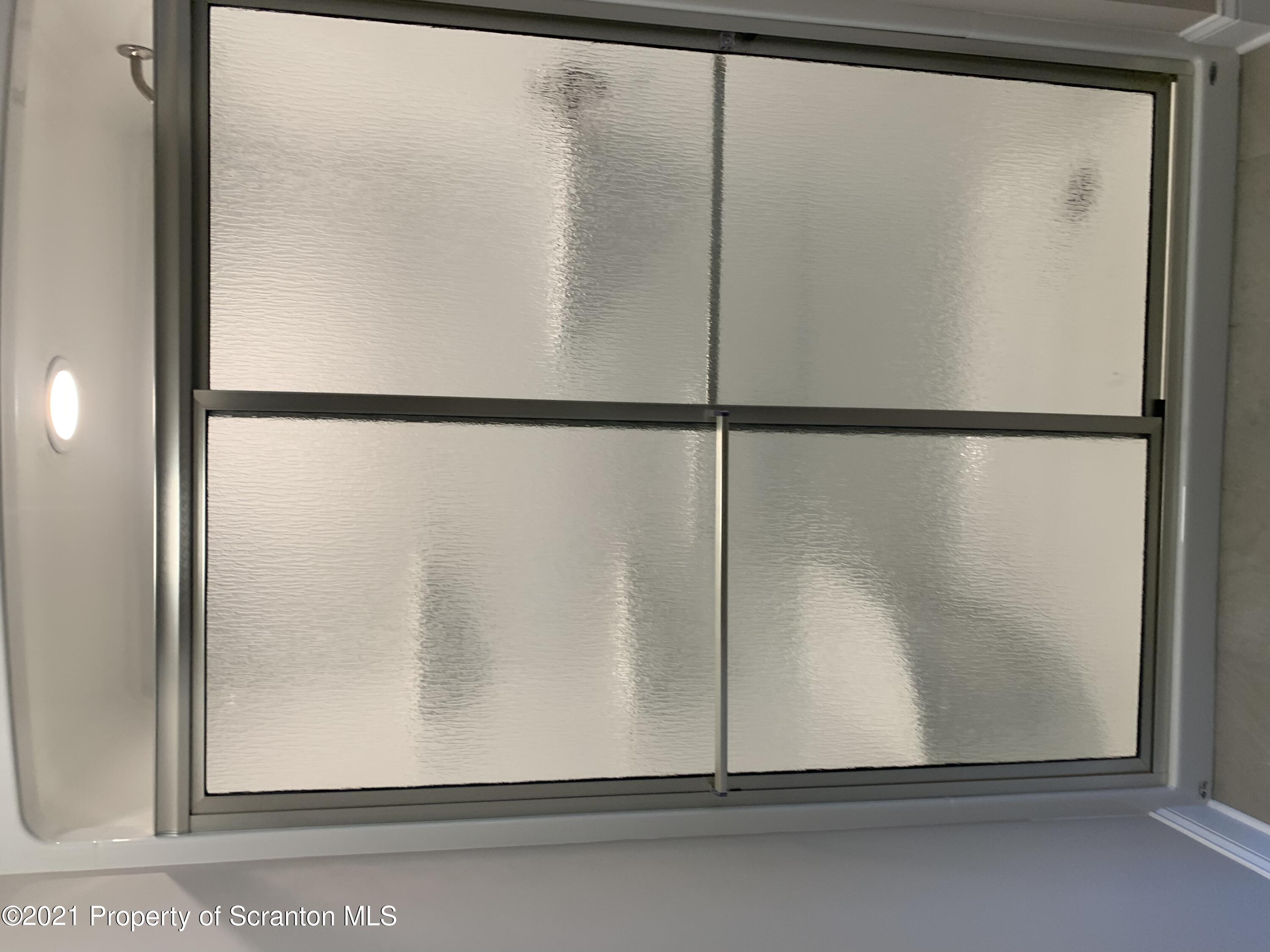 104 Deerfield Drive Eynon, PA 18403 - Photo 17 of 25 an empty glass door with a glass door