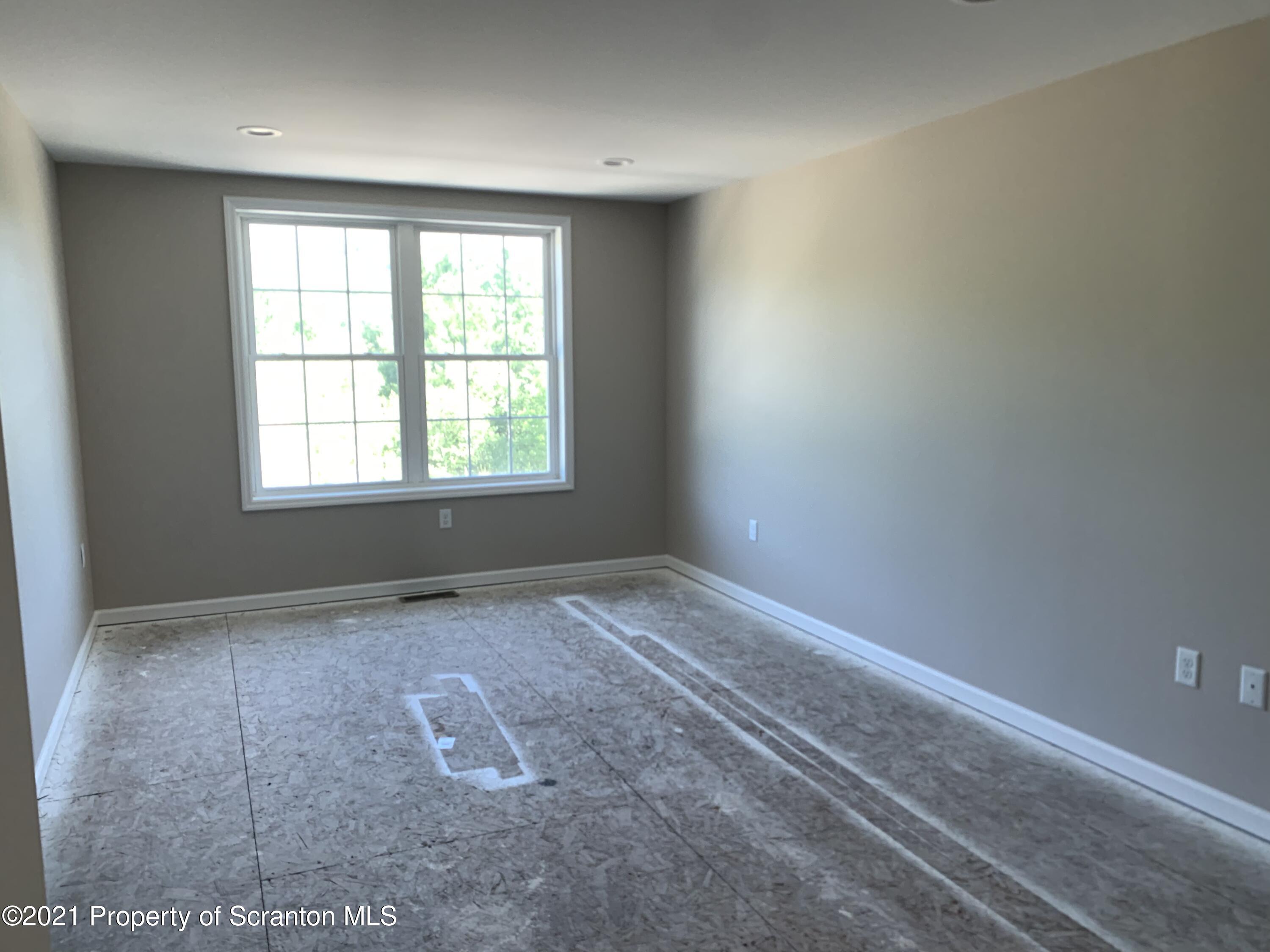 104 Deerfield Drive Eynon, PA 18403 - Photo 20 of 25 an empty room with a window