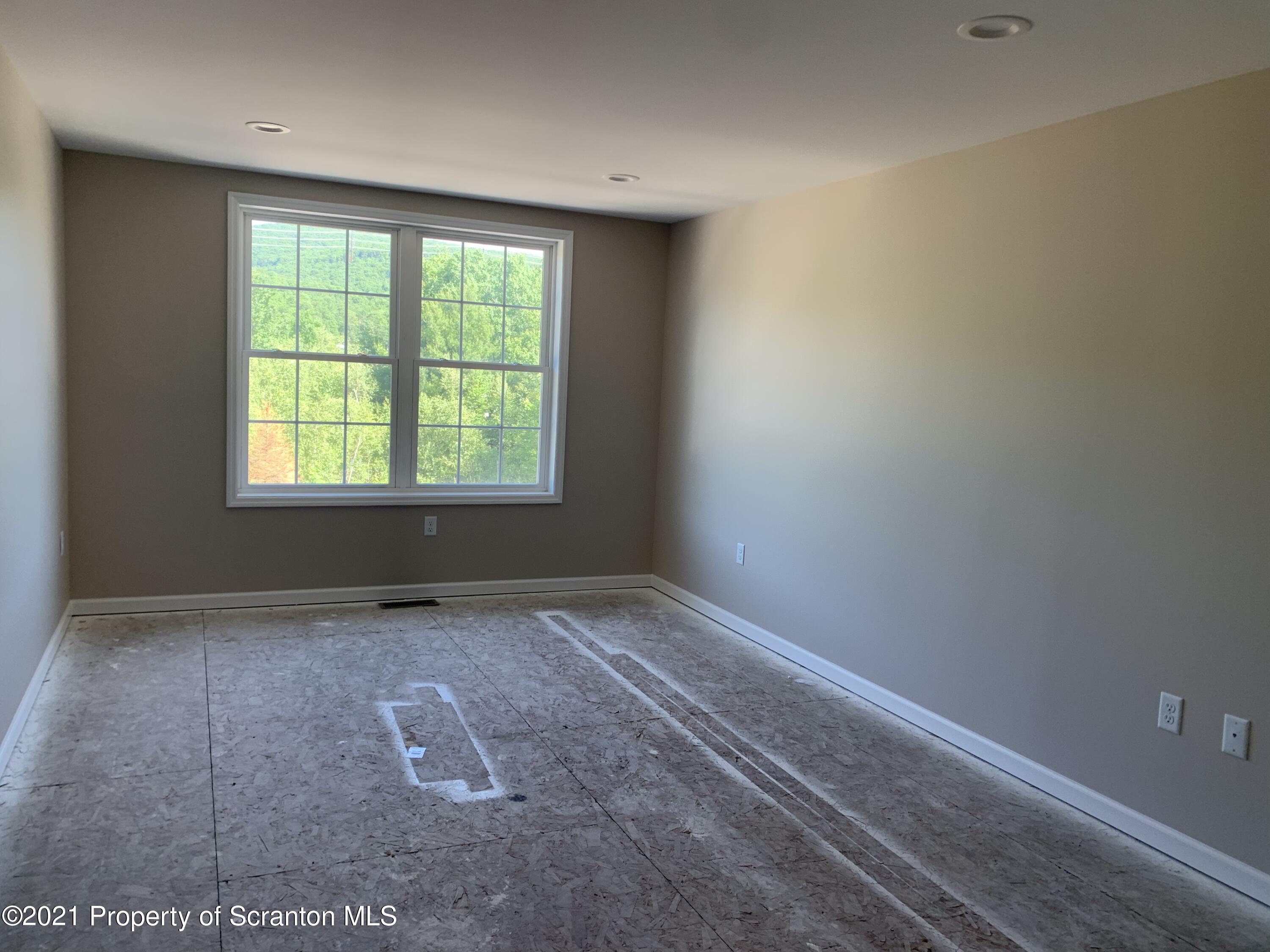 104 Deerfield Drive Eynon, PA 18403 - Photo 21 of 25 an empty room with a window