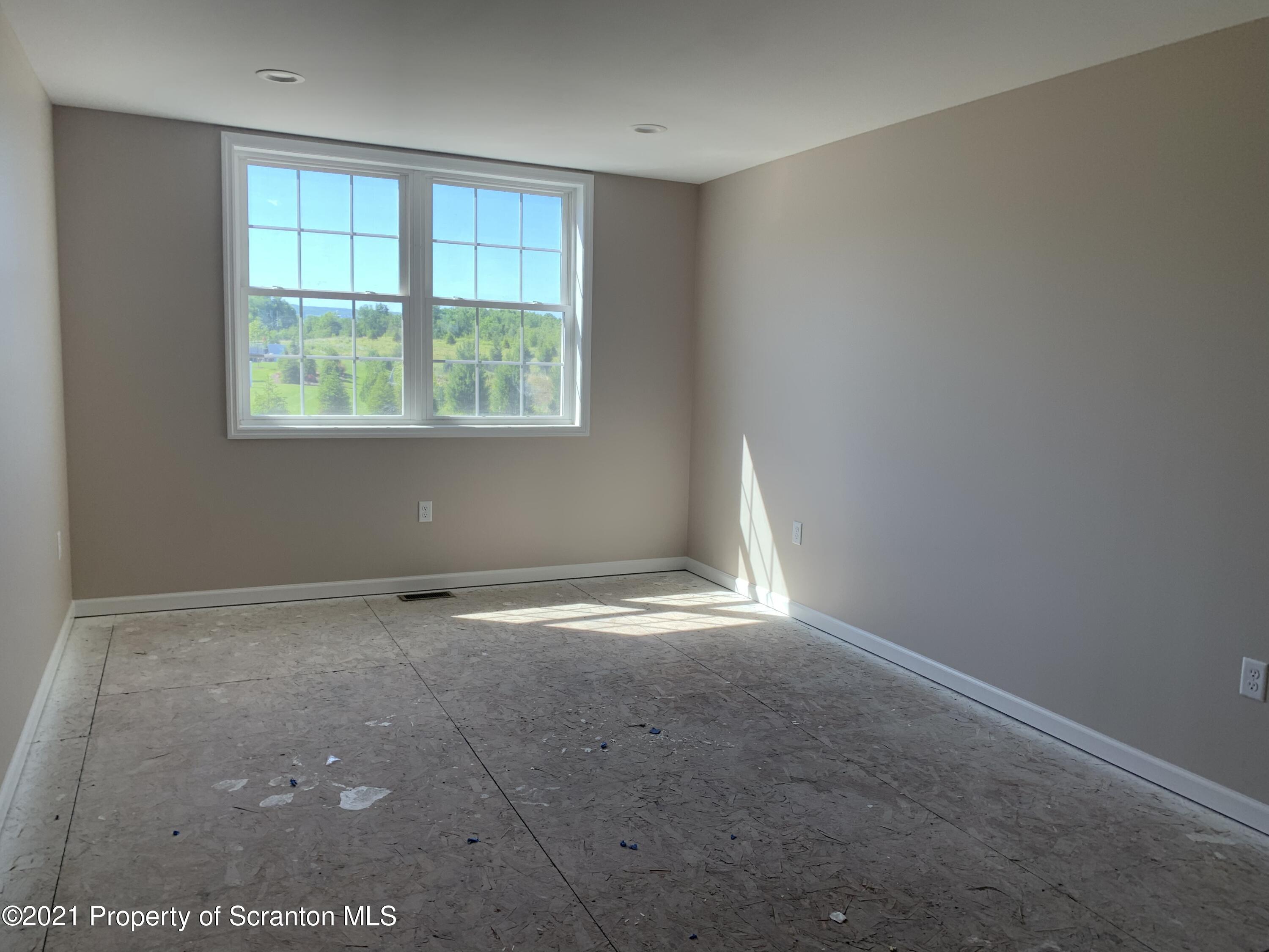 104 Deerfield Drive Eynon, PA 18403 - Photo 24 of 25 an empty room with a window