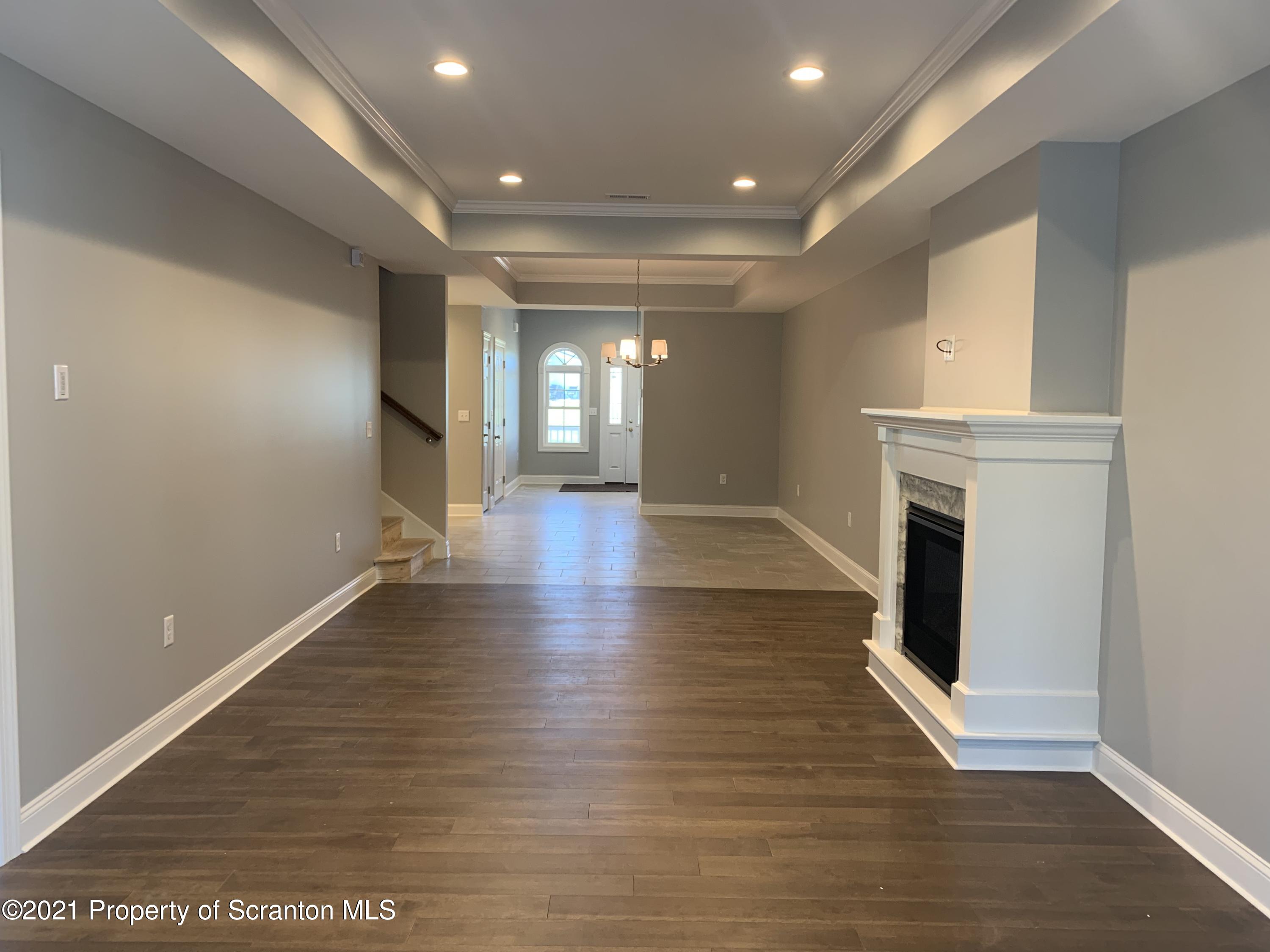 104 Deerfield Drive Eynon, PA 18403 - Photo 9 of 25 a view of a livingroom with wooden floor