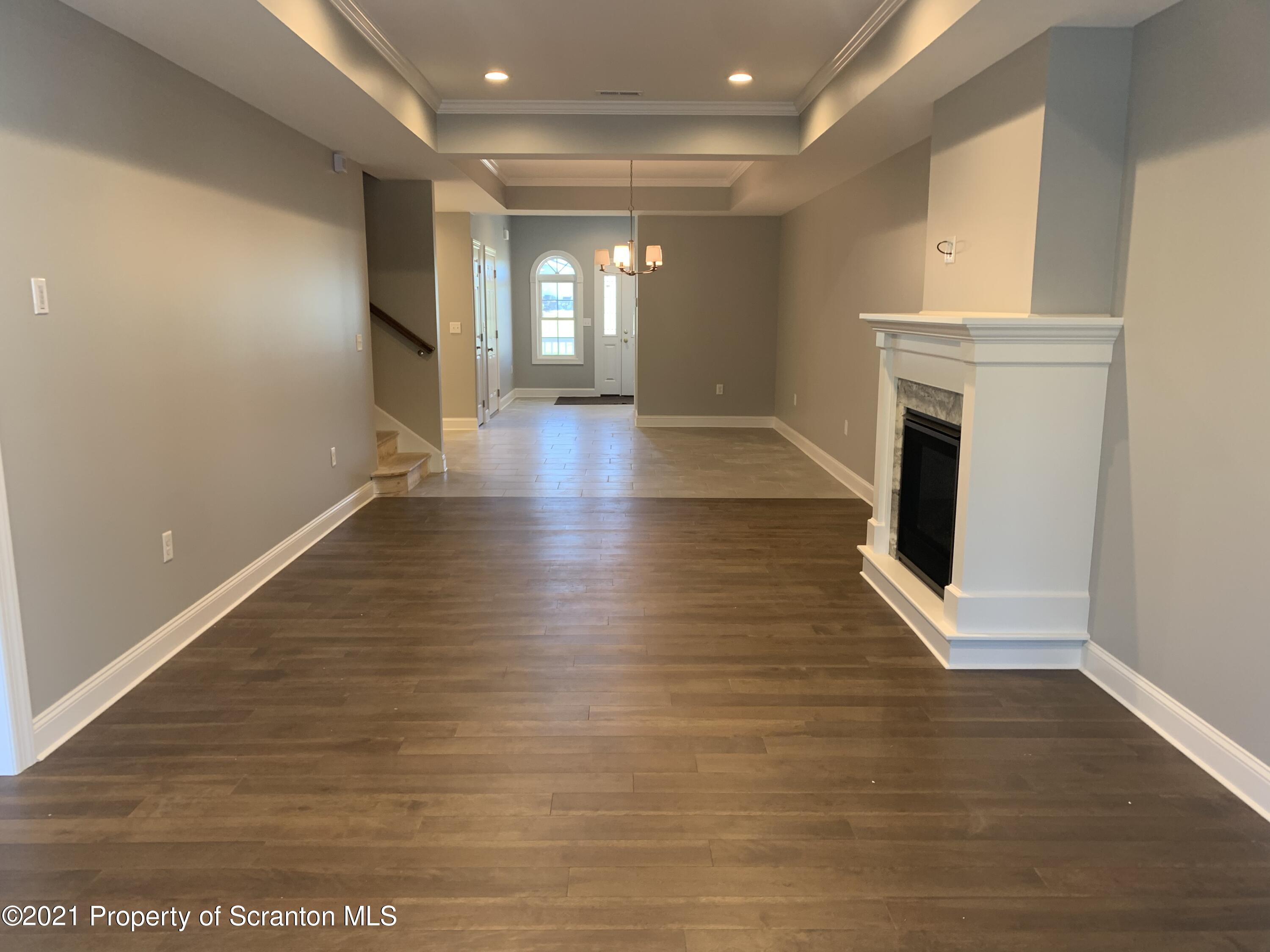 104 Deerfield Drive Eynon, PA 18403 - Photo 10 of 25 a view of a livingroom with wooden floor
