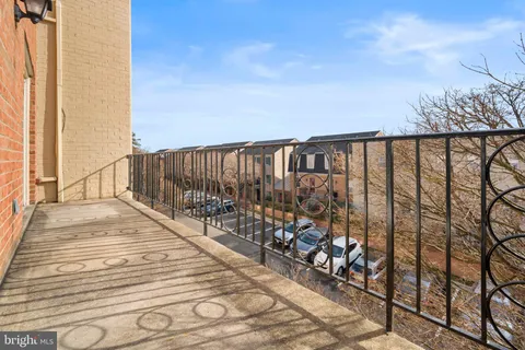 a balcony with wooden floor