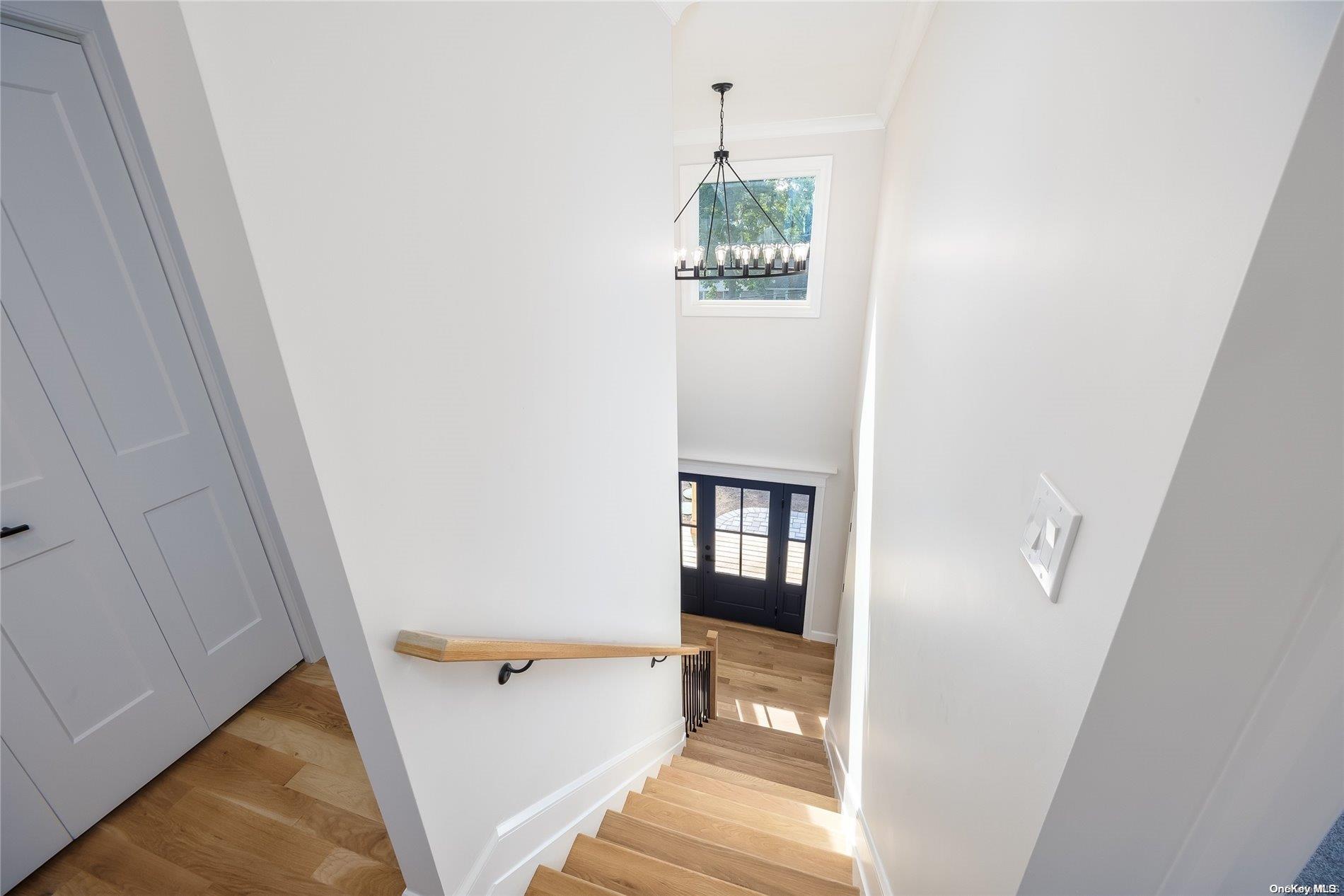30 Pleasant Avenue Centereach, NY 11720 - Photo 13 of 23 a view of a hallway with wooden floor and entryway