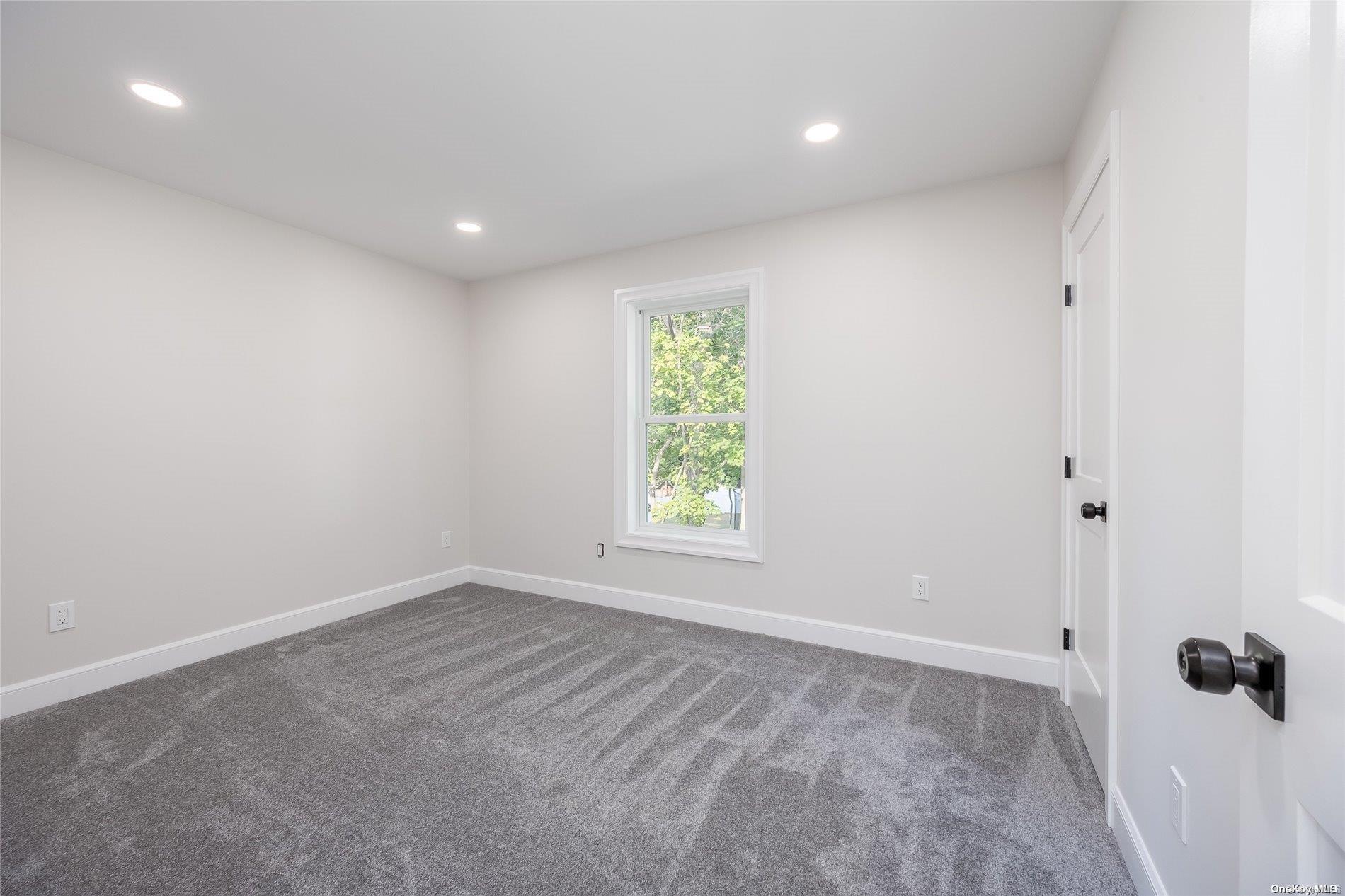 30 Pleasant Avenue Centereach, NY 11720 - Photo 23 of 23 an empty room with a window