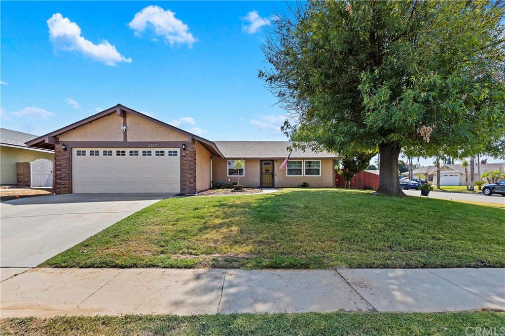 22537 Raven Way Grand Terrace, CA 92313 - Photo 1 of 1 a front view of a house with a yard