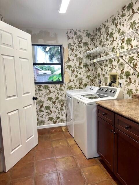 6362 Barbara Street Jupiter, FL 33458 - Photo 15 of 20 a bathroom with a granite countertop sink a mirror and shower