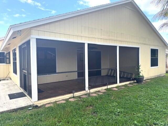 6362 Barbara Street Jupiter, FL 33458 - Photo 18 of 20 a view of front door and yard