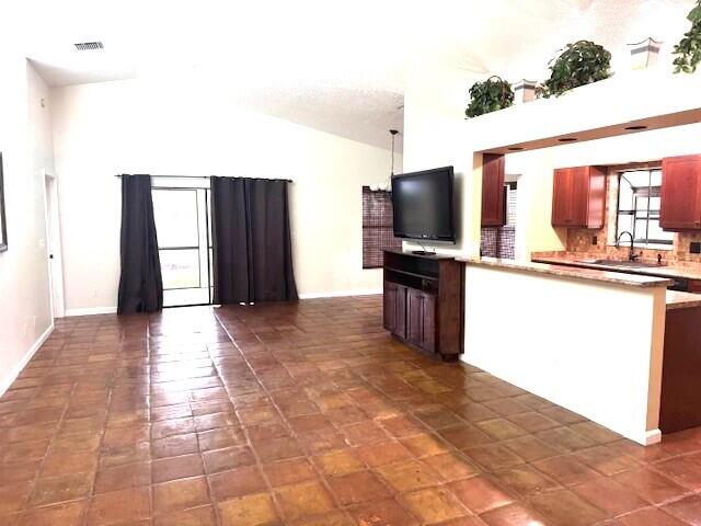 6362 Barbara Street Jupiter, FL 33458 - Photo 2 of 20 a view of a kitchen with cabinets and stainless steel appliances