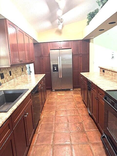 6362 Barbara Street Jupiter, FL 33458 - Photo 5 of 20 a kitchen with stainless steel appliances granite countertop a sink and cabinets