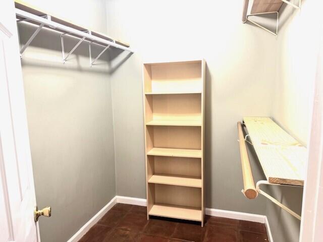 6362 Barbara Street Jupiter, FL 33458 - Photo 8 of 20 a view of walk in closet with empty racks