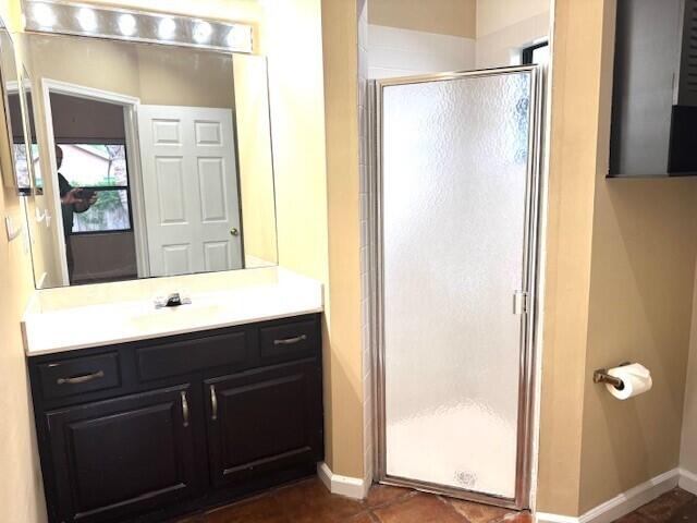 6362 Barbara Street Jupiter, FL 33458 - Photo 9 of 20 a bathroom with a sink and mirror