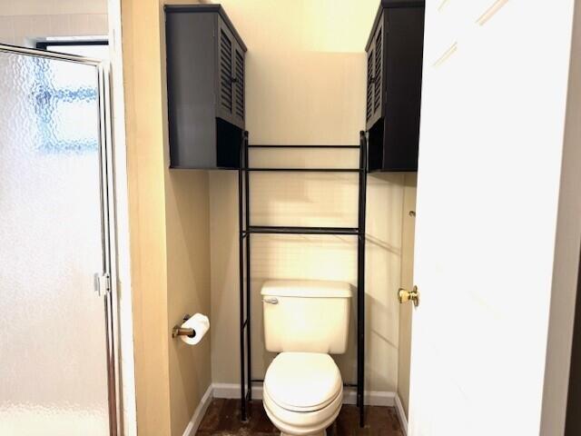 6362 Barbara Street Jupiter, FL 33458 - Photo 10 of 20 a white toilet sitting next to a bathroom sink