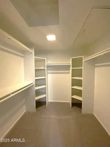 a view of an empty walk in closet