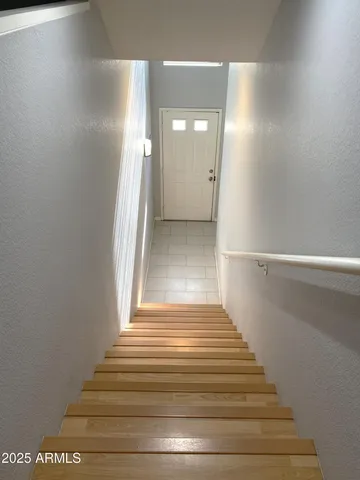 a view of entryway and hall with a hallway