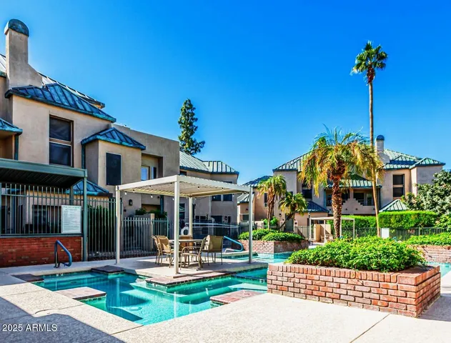 a front view of a house with porch and garden