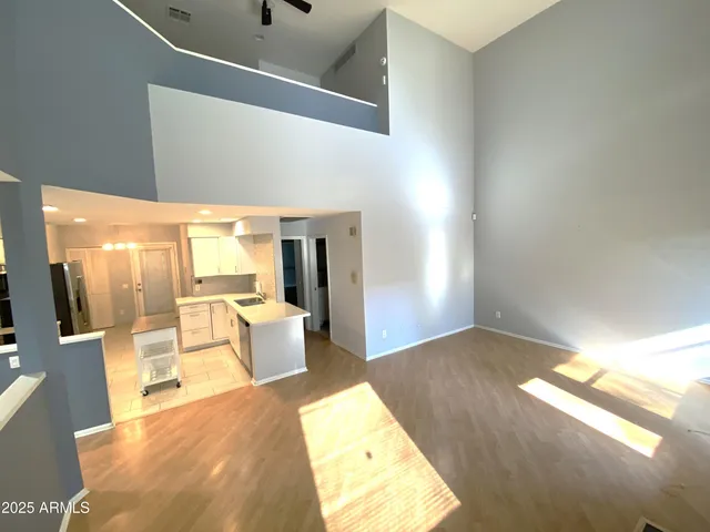 a view of a living room with a fireplace