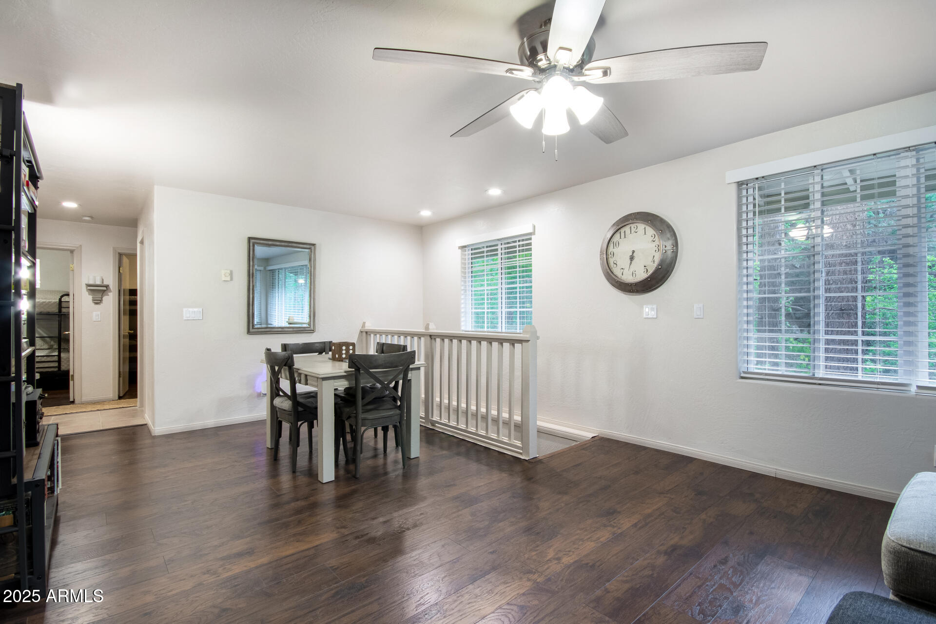 8475 South Breezy Pine Road Mayer, AZ 86333 - Photo 16 of 43 a view of a dining room and livingroom with furniture wooden floor and a clock