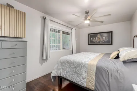 a bedroom with a large bed and a window