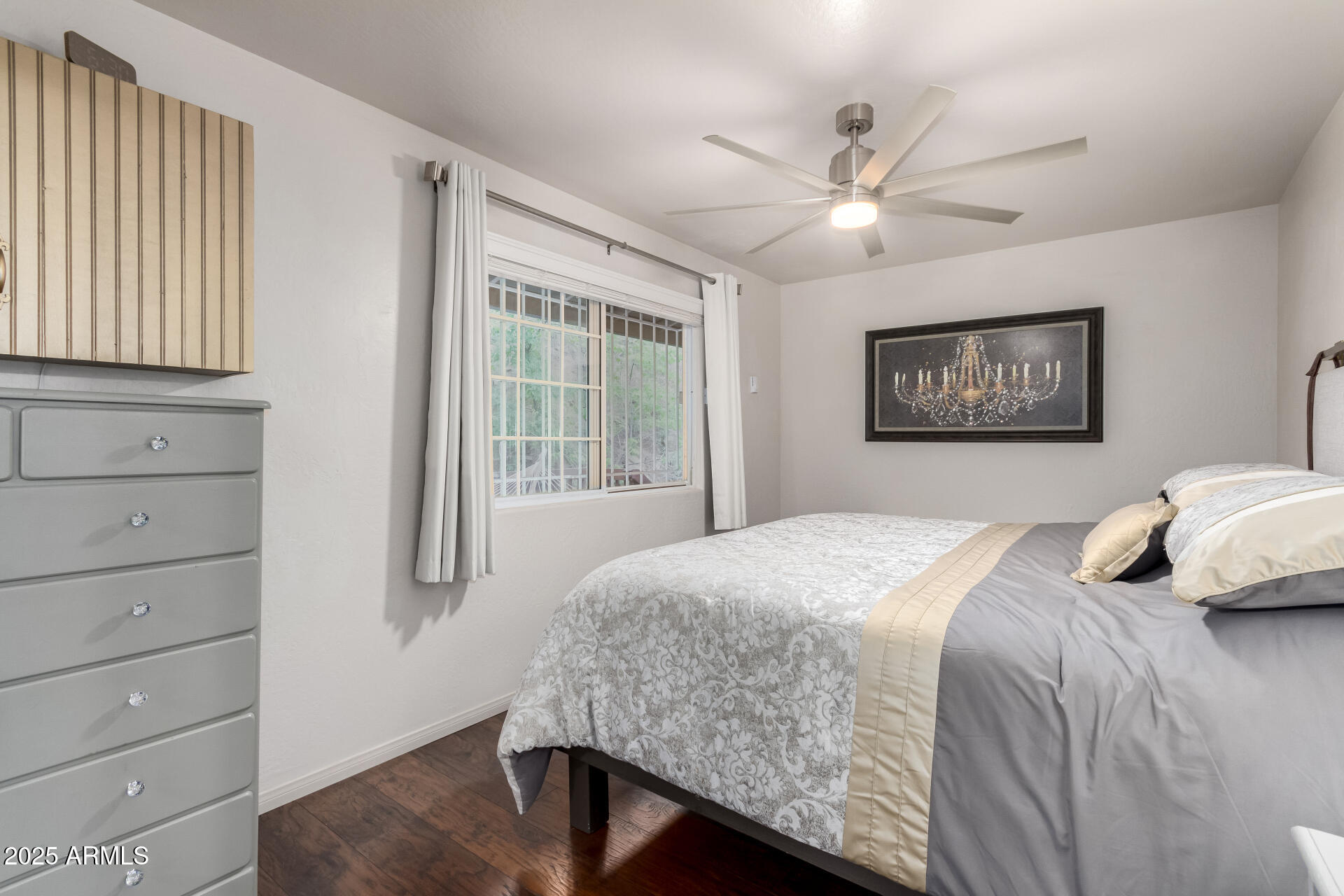 8475 South Breezy Pine Road Mayer, AZ 86333 - Photo 17 of 43 a bedroom with a large bed and a window
