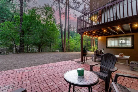 a view of a patio with a table chairs and a potted plants