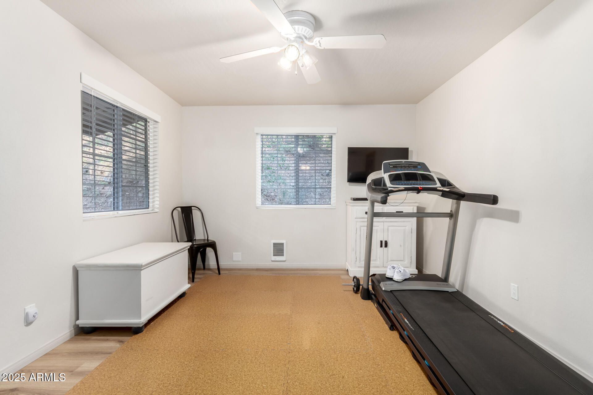8475 South Breezy Pine Road Mayer, AZ 86333 - Photo 22 of 43 a room with gym equipment and a window