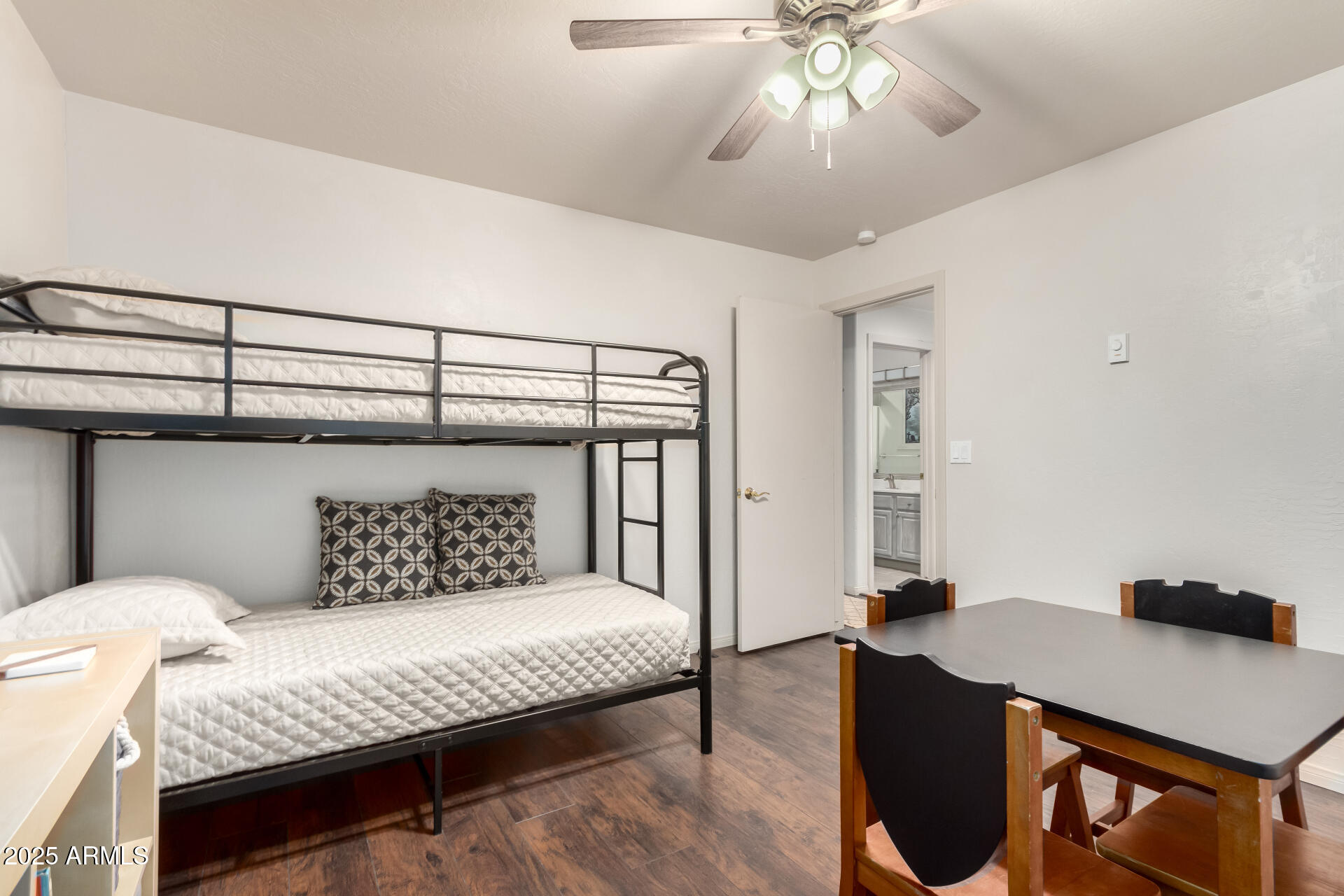 8475 South Breezy Pine Road Mayer, AZ 86333 - Photo 28 of 43 a bedroom with a bed and a chandelier