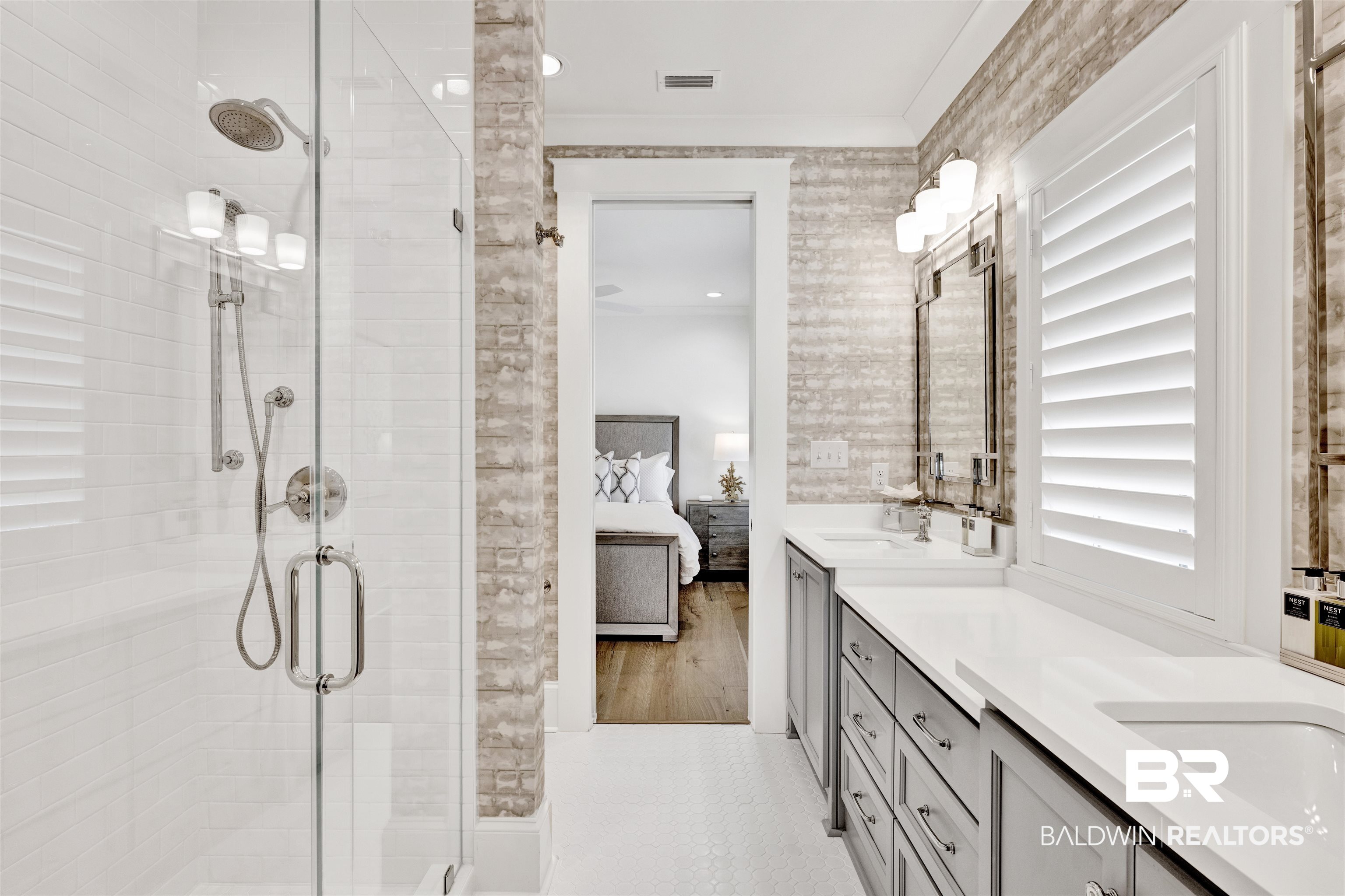 861 Inlet Circle Gulf Shores, AL 36542 - Photo 33 of 54 Bathroom featuring ensuite bath, double vanity, a stall shower, and crown molding