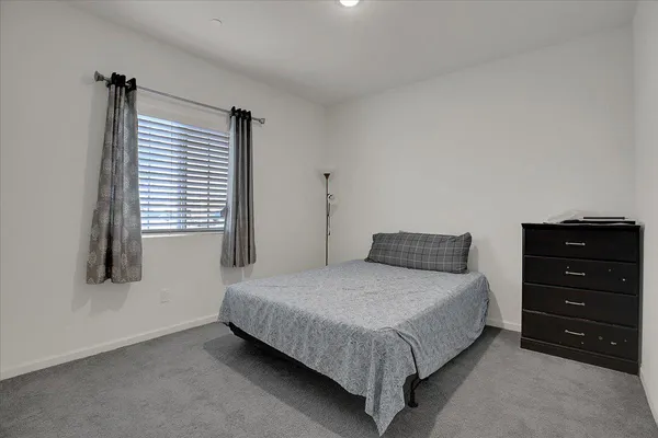 a bedroom with a bed and a closet