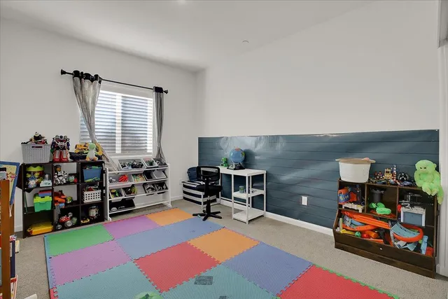 a bedroom with furniture and a wooden floor