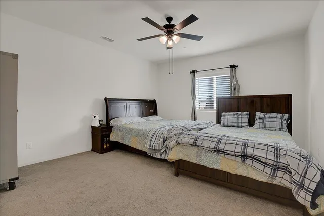 a bedroom with a bed and window