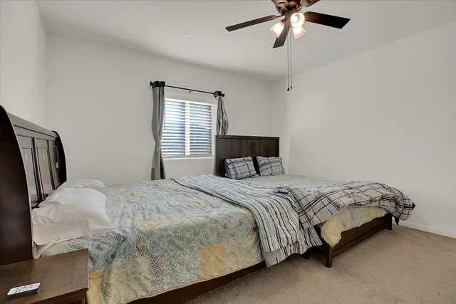 a bedroom with a bed and window