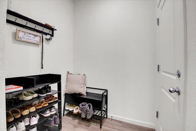 a view of livingroom with furniture and a lamp