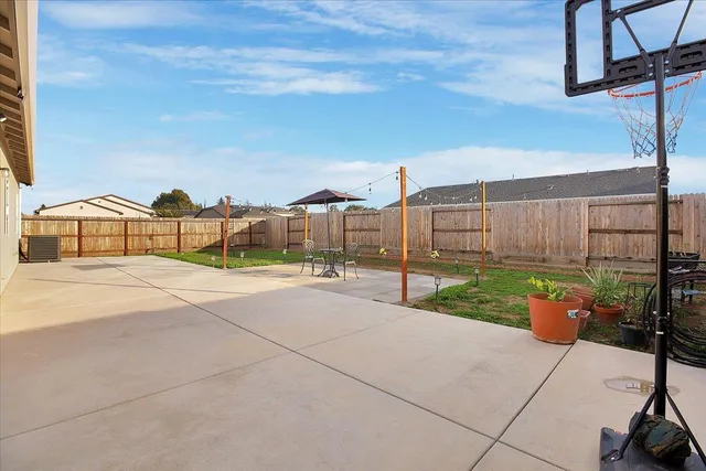 a view of a street with brick wall