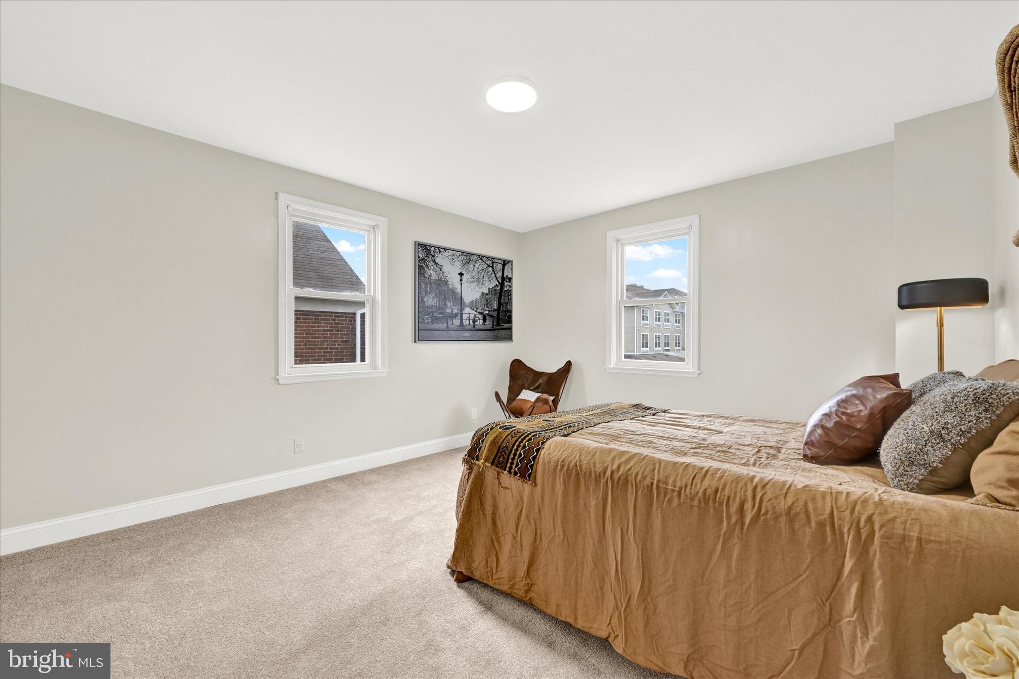 3940 Penhurst Avenue Baltimore, MD 21215 - Photo 12 of 24 a bedroom with a bed and a window