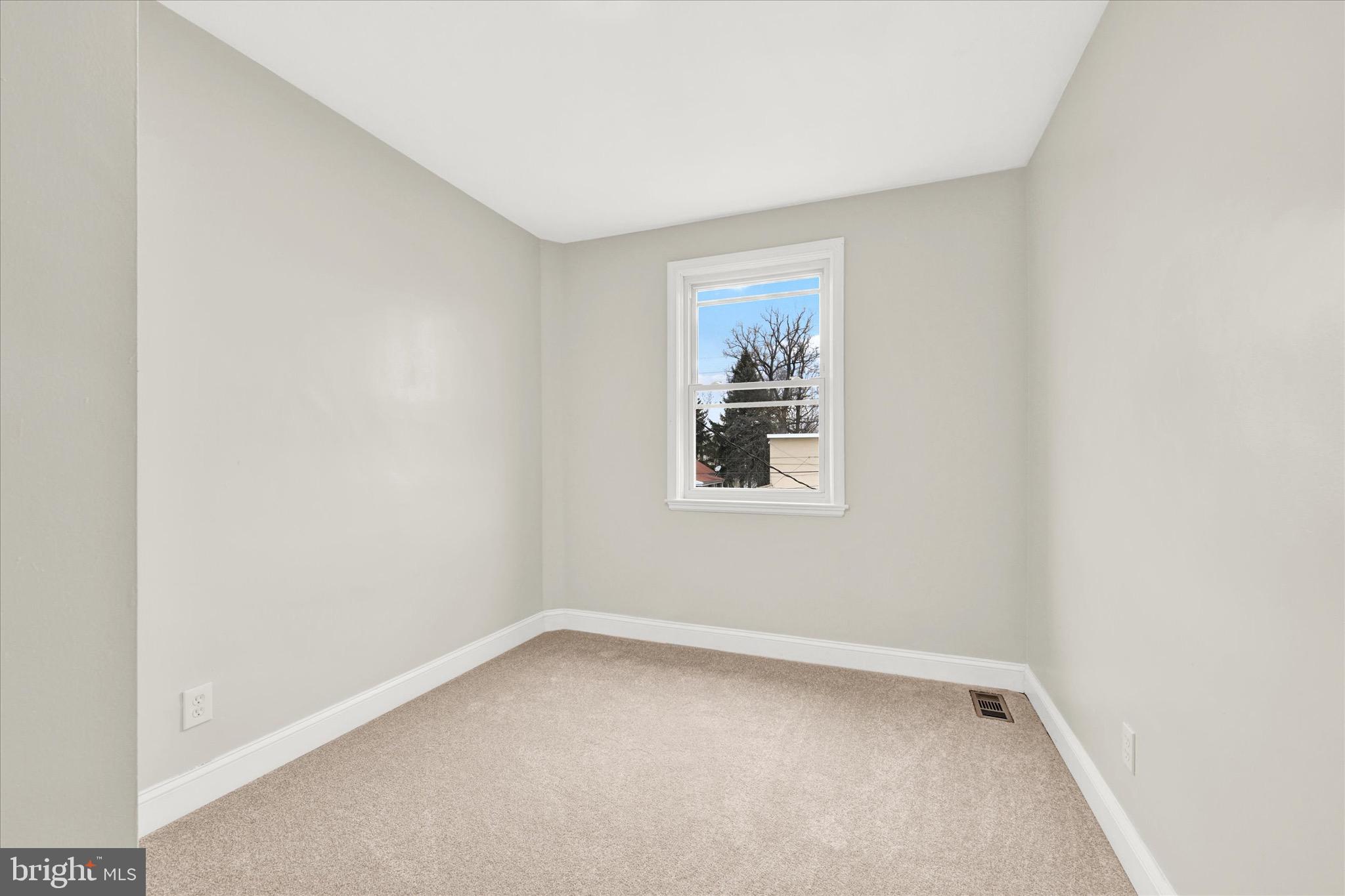 3940 Penhurst Avenue Baltimore, MD 21215 - Photo 17 of 24 an empty room with a window
