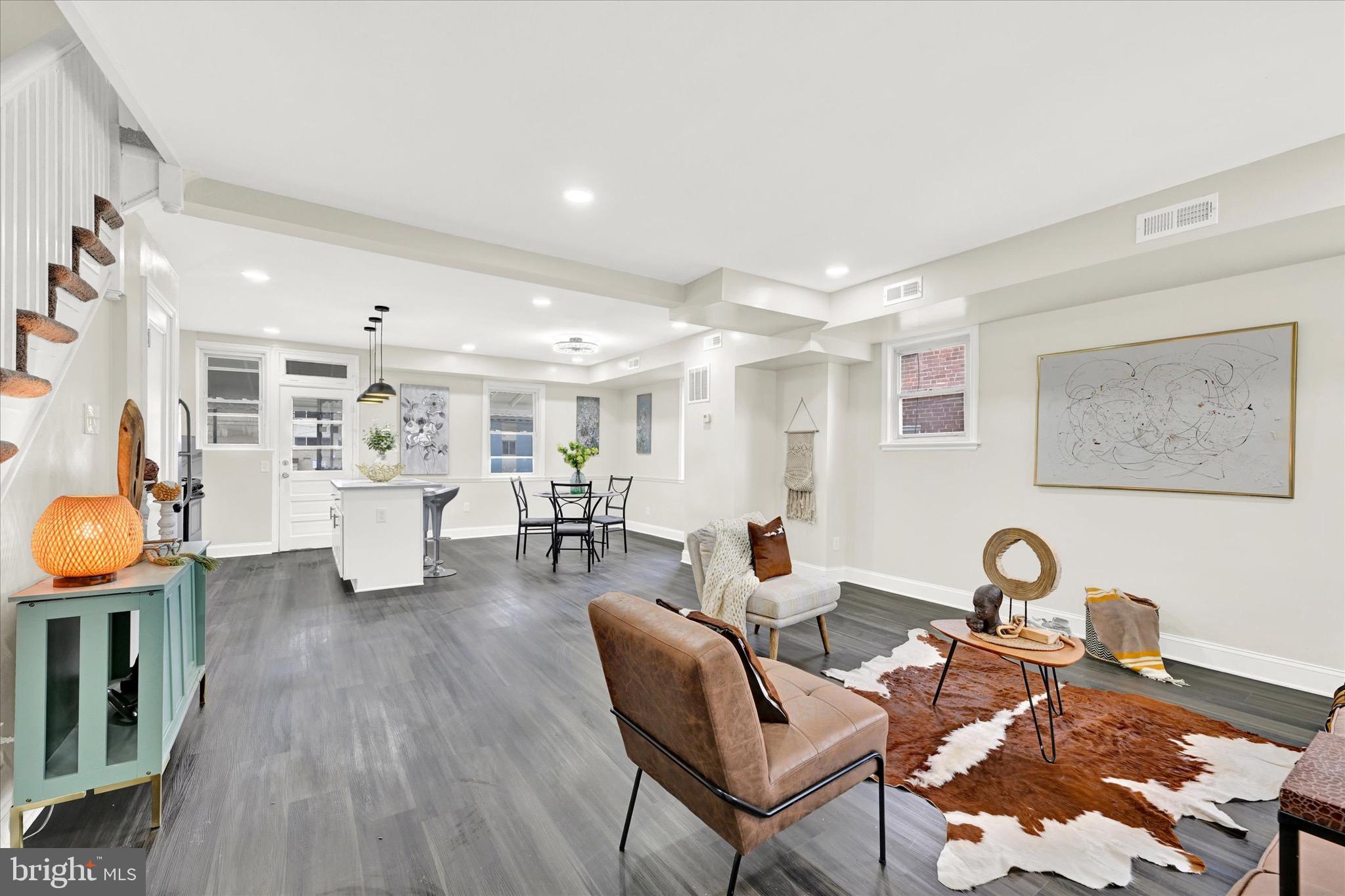 3940 Penhurst Avenue Baltimore, MD 21215 - Photo 2 of 24 a living room with furniture and a wooden floor