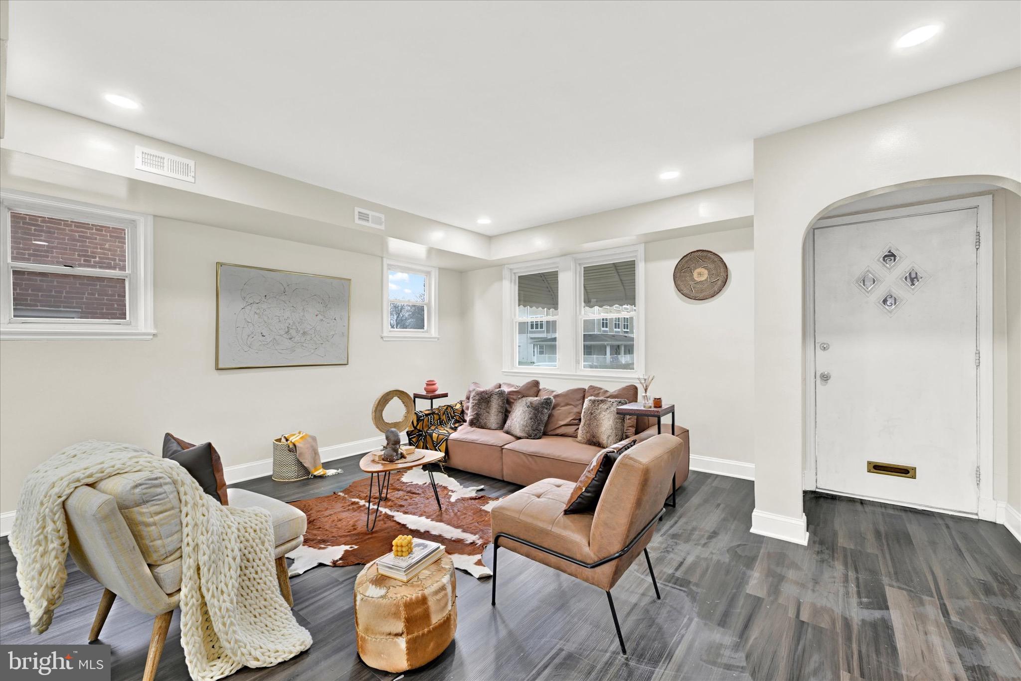 3940 Penhurst Avenue Baltimore, MD 21215 - Photo 3 of 24 a living room with furniture and a wooden floor