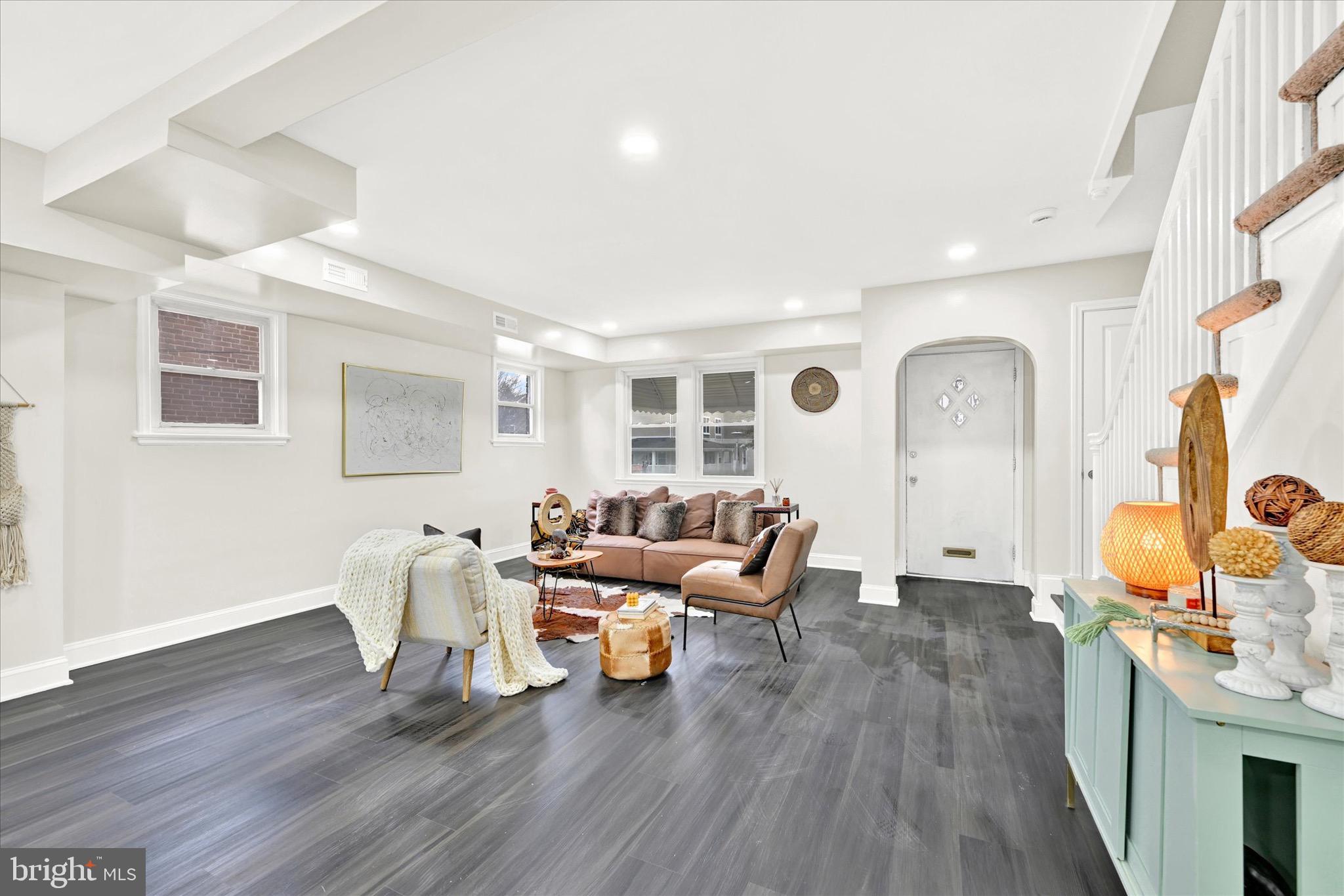 3940 Penhurst Avenue Baltimore, MD 21215 - Photo 5 of 24 a living room with furniture or wooden floor and a large window