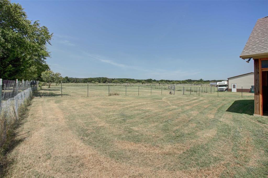 8789 Hutcheson Hill Road Springtown, TX 76082 - Photo 25 of 29 View of yard featuring a view of rural / pastoral area
