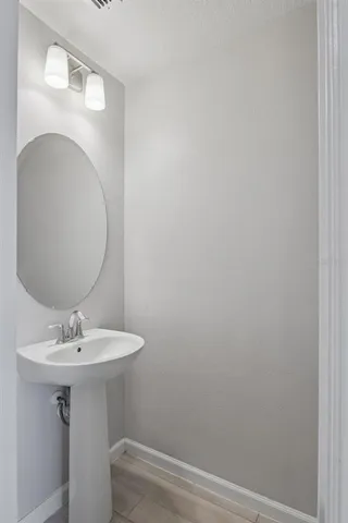 a bathroom with a sink toilet