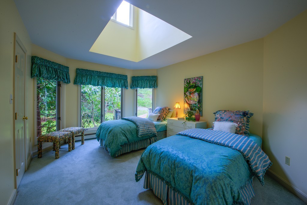 78 Sawmill Road Barnstable, MA 02648 - Photo 13 of 25 a bedroom with two beds and large windows