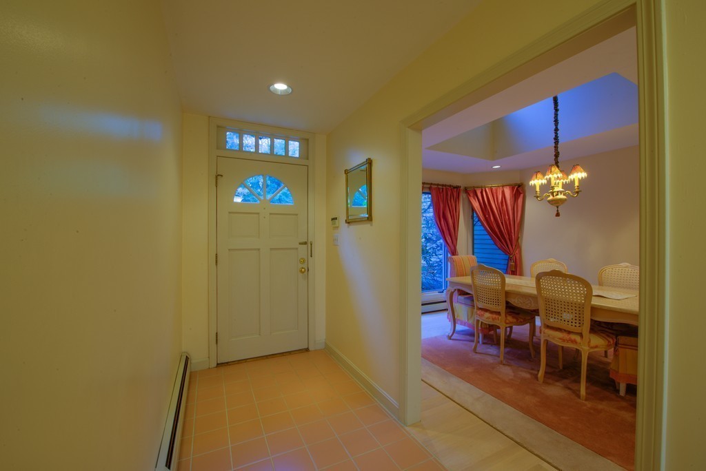 78 Sawmill Road Barnstable, MA 02648 - Photo 19 of 25 a dining room with furniture and chandelier