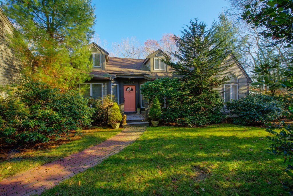 78 Sawmill Road Barnstable, MA 02648 - Photo 2 of 25 a view of a house with a yard table and chairs
